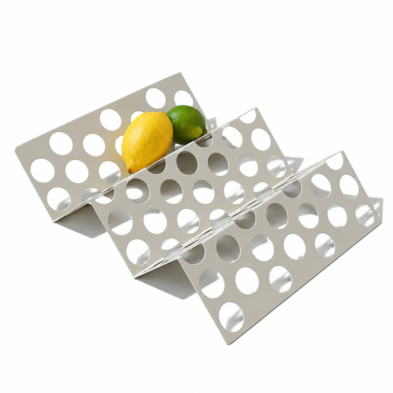 Colorful Zig Zag fruit platter by Halfwerk featuring an assortment of fresh sliced fruits arranged in a decorative pattern.