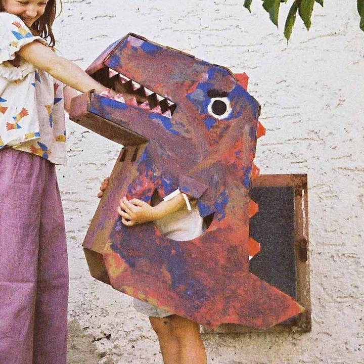Colorful mini dinosaur toy by Papperlapapp featuring vibrant scales and small size, perfect for play or display.