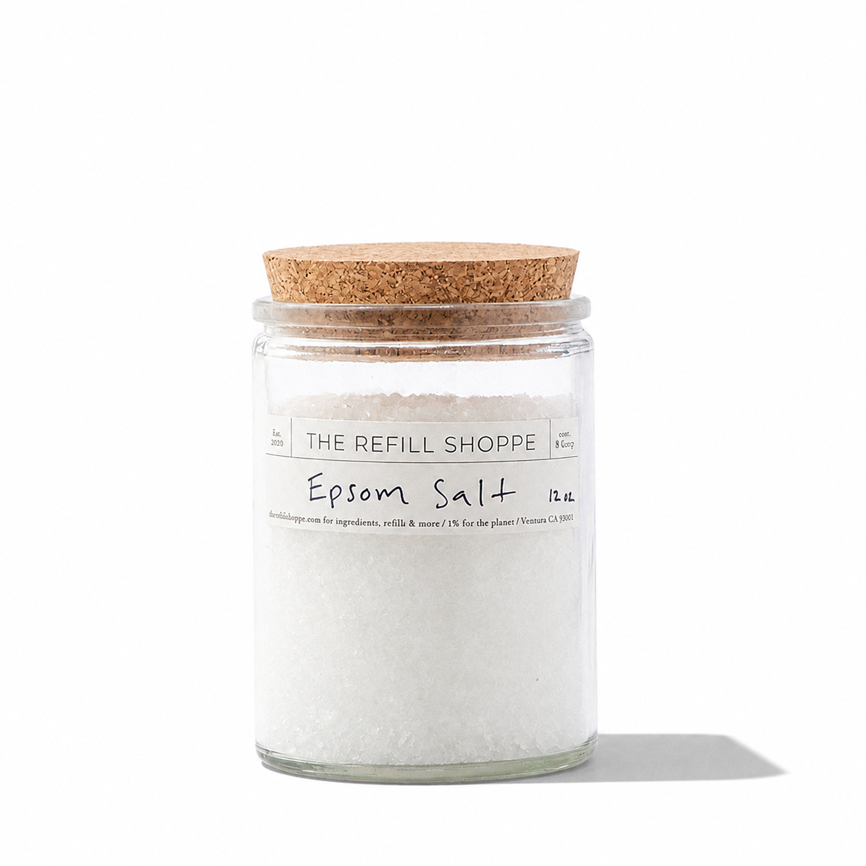 Epsom Bath Salt from The Refill Shoppe in a clear glass jar, showing white crystalline bath salts for relaxation and soothing baths.