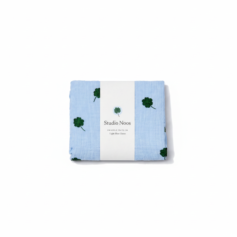 Studio Noos Clover Swaddle, soft and cozy baby swaddle blanket with a charming clover pattern, ideal for newborns.