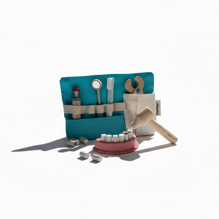 PlanToys Dentist Play Set with toy dental tools, dental chair, and accessories for imaginative role-playing.