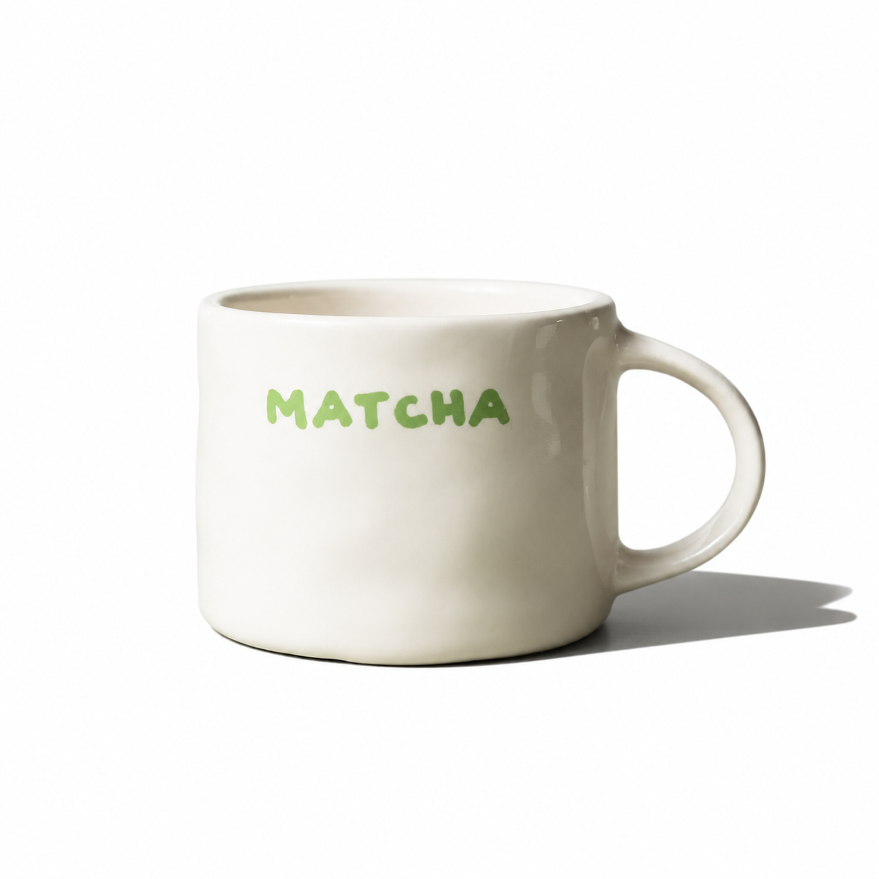 Sisi House of Style Matcha Mug with green and white design, ceramic coffee cup with a smooth handle and decorative pattern.