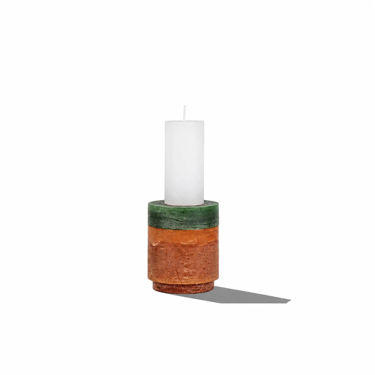 Stacked candles from Stan Editions' Candl Stack 02 collection displayed in a modern holder.