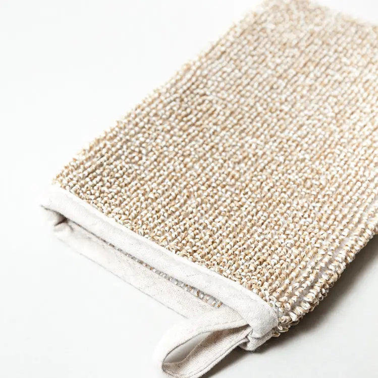Deep exfoliating body scrub mitt by Morihata International Ltd. Co., showing a textured mitten designed for skin exfoliation.