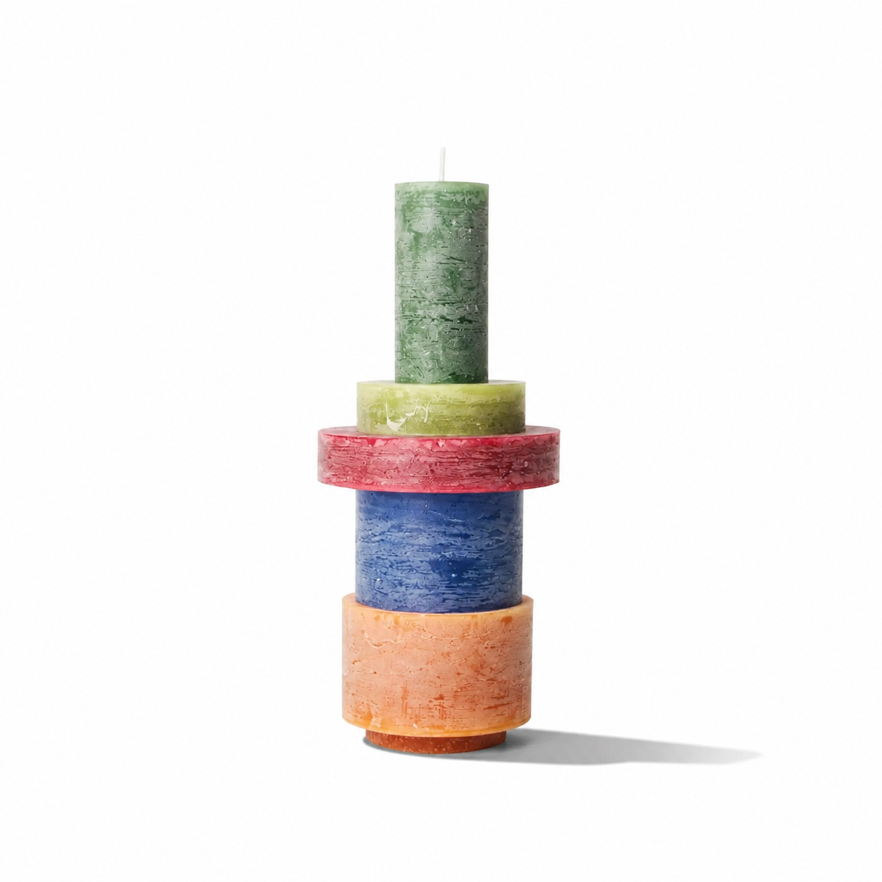 Stack of three modern Candl Stack 03 candles by Stan Editions, with varying heights and neutral-colored wax.