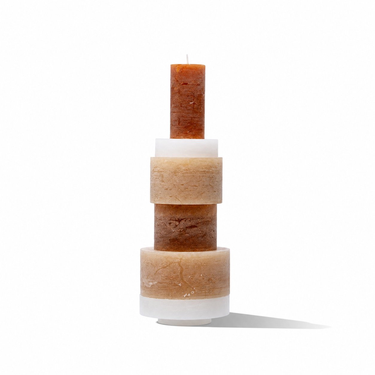 Stack of white candles from Stan Editions Candl Stack 06 with layered, modern design, arranged in a visually appealing display.