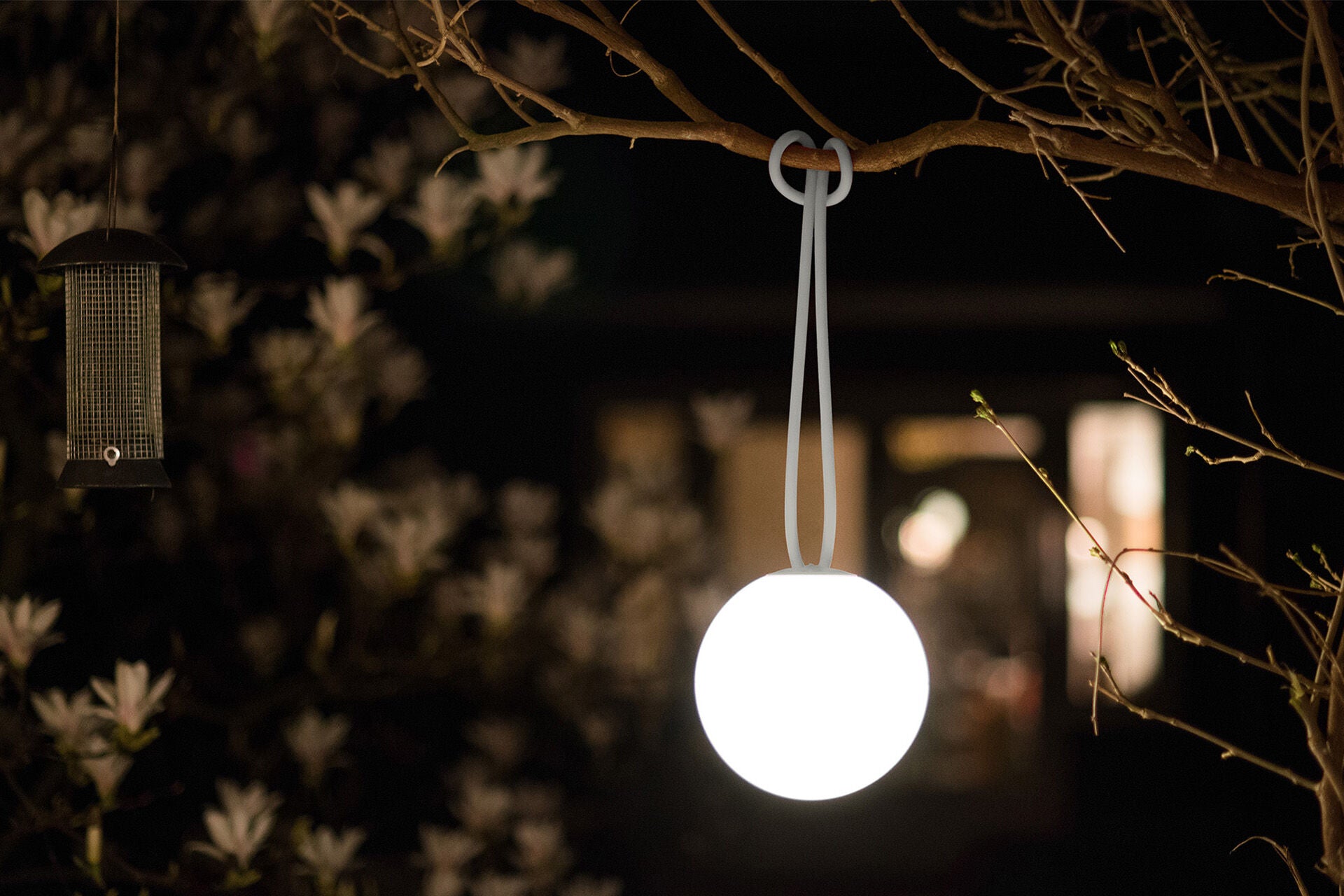 Fatboy Bolleke lighting in light grey emitting a soft glow, designed for ambient home or outdoor decor.