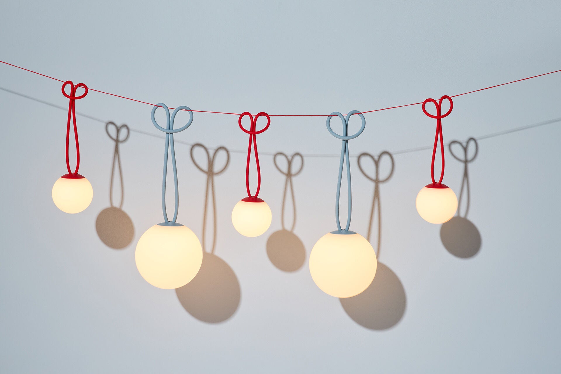 Red Fatboy Bolleke Mini Set of 3 LED light fixtures, compact and stylish verlichtings for indoor or outdoor decor.