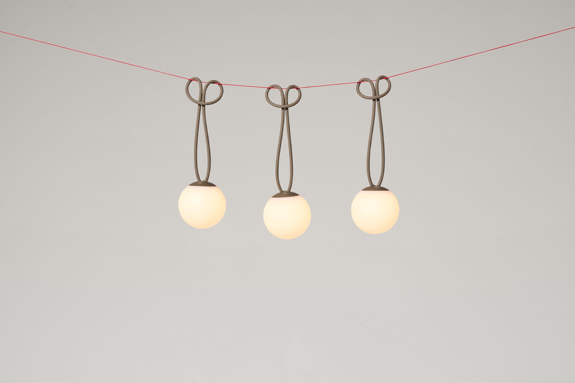 Set of three taupe Fatboy Bolleke Mini Verlichting lights with round, modern design and compact size for stylish lighting.