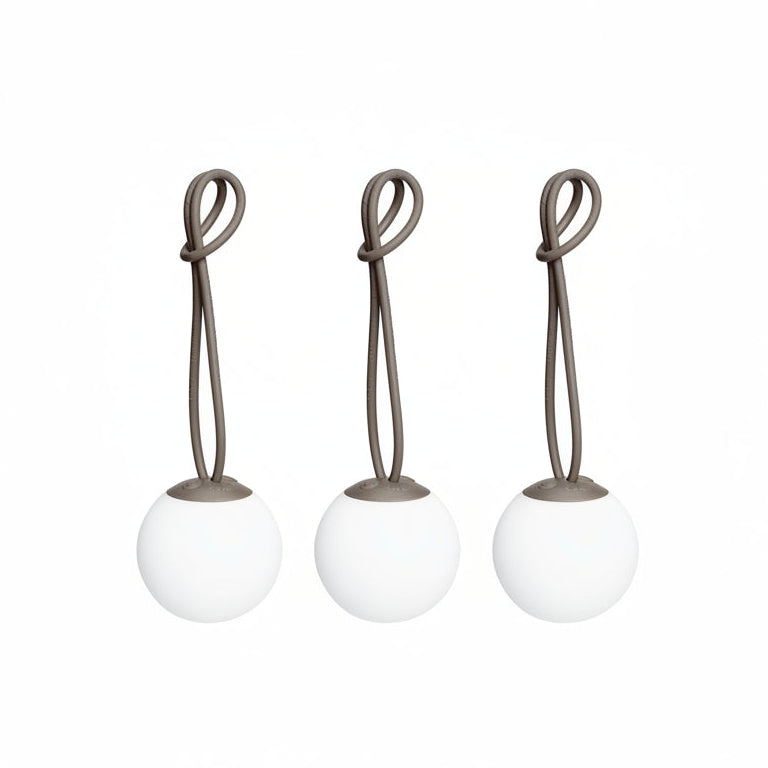 Set of three taupe Fatboy Bolleke Mini LED lights for decorative lighting, featuring modern spherical design and warm glow.