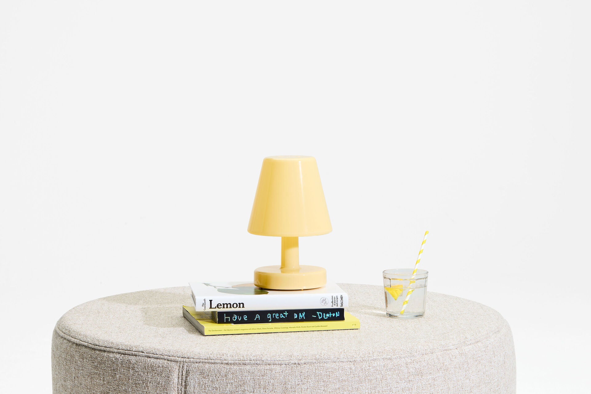 Pale yellow Fatboy Edison The Ambiance lighting fixture with modern design and soft glow, ideal for cozy home ambiance.