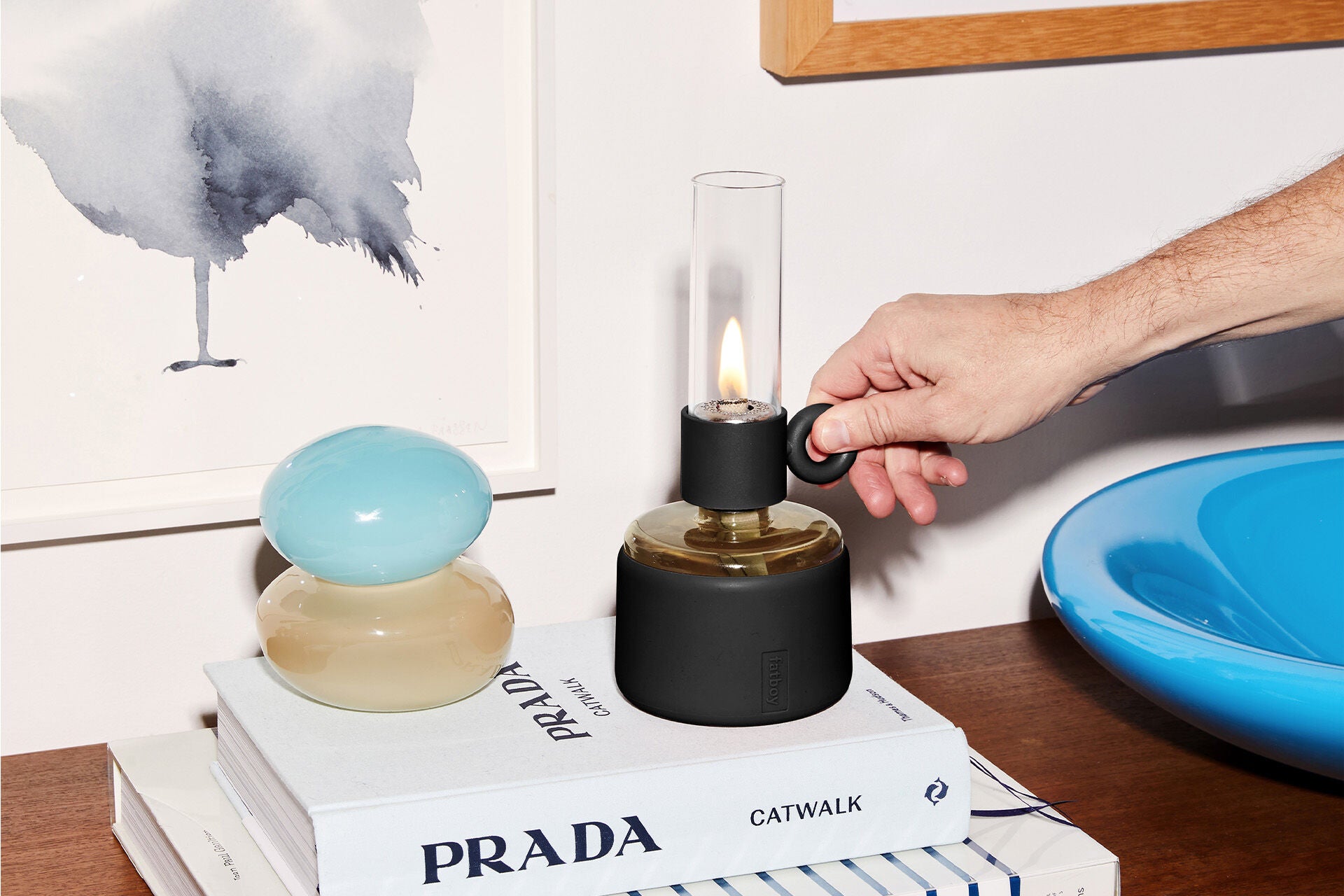 Black Flamtastique XS lighting by Fatboy showcasing its sleek, modern design with a glowing flame effect for ambient illumination.