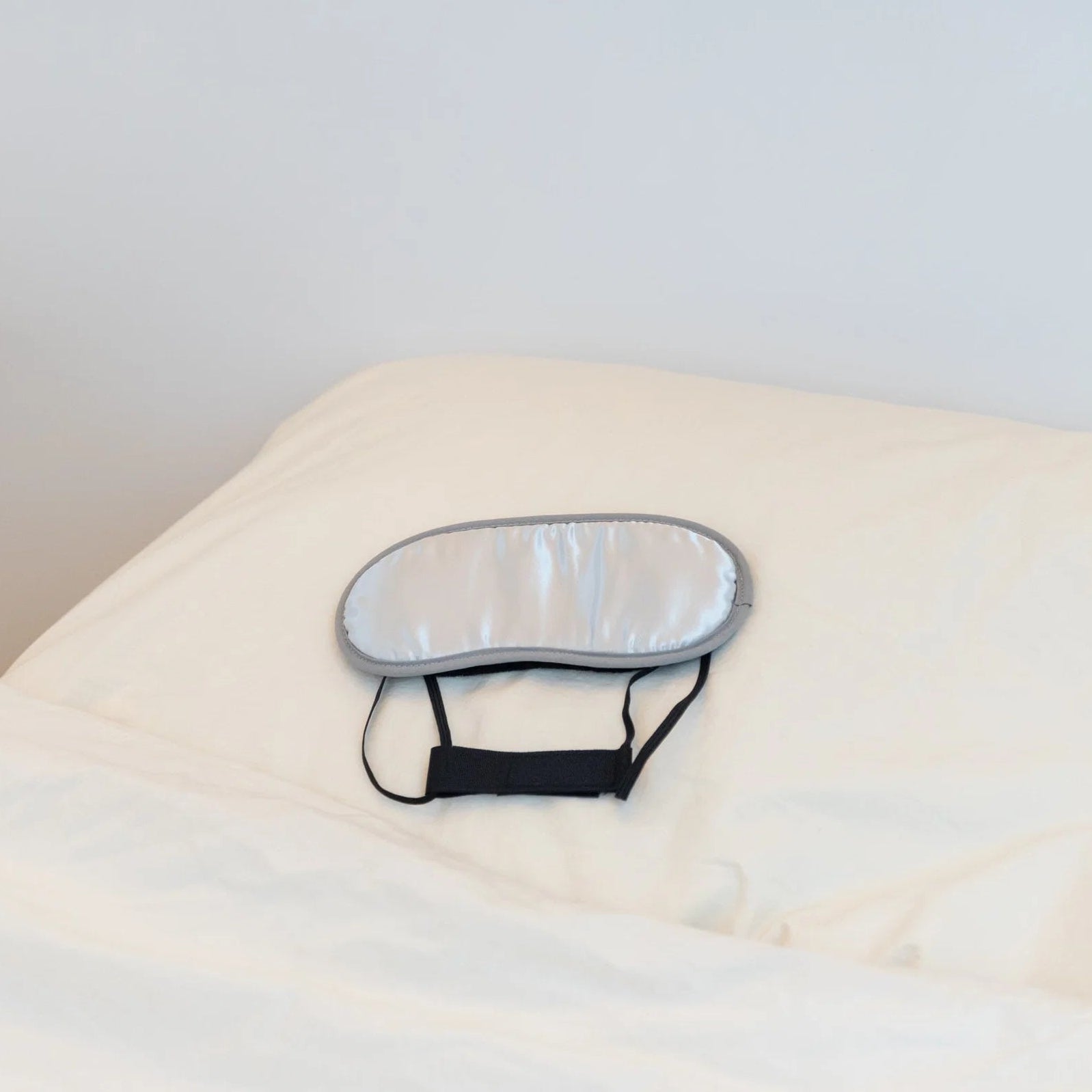 Morihata International Ltd. Co. charcoal eye mask showing soft fabric with charcoal-infused material for soothing eye treatment.