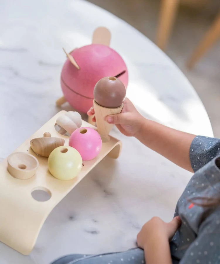 PlanToys frozen treat made of natural materials, shaped like an ice cream cone with colorful details, perfect for imaginative play.
