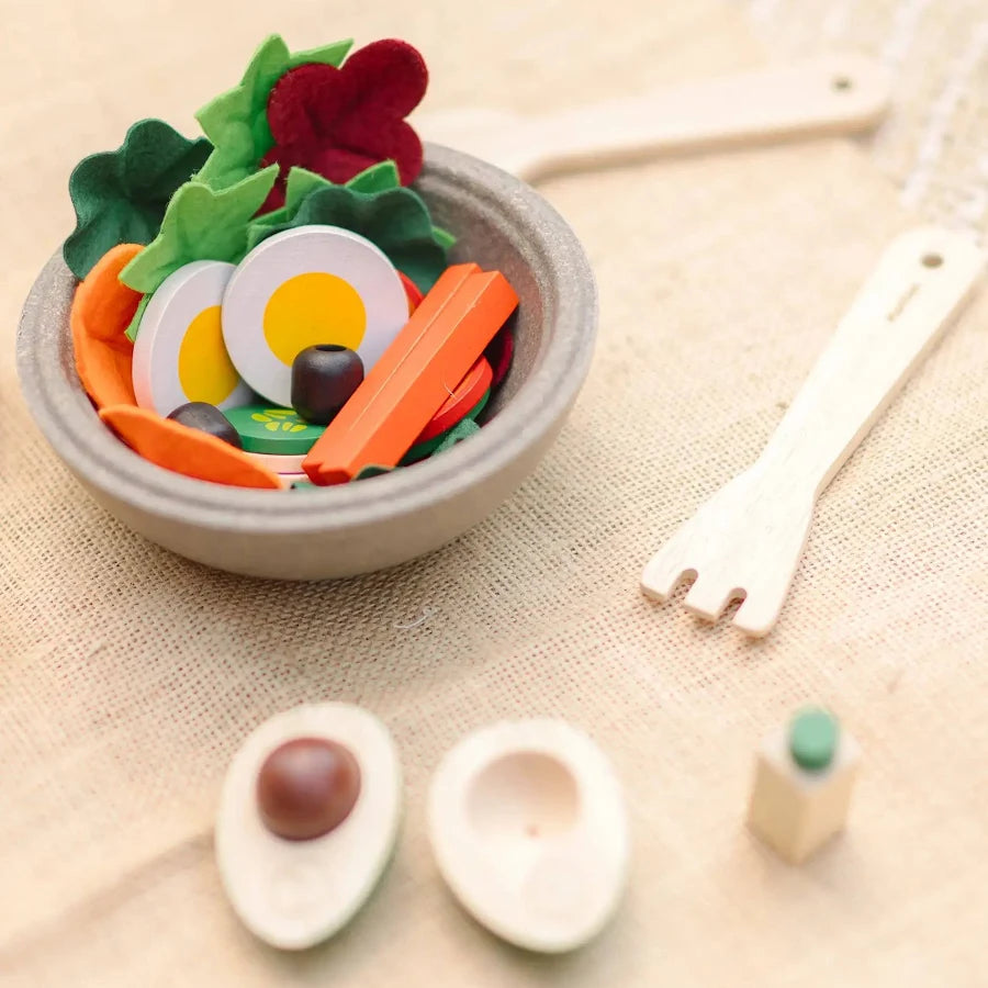 PlanToys pretend salad set with toy vegetables and bowl, ideal for children's imaginative play and role-playing activities.
